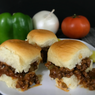 sloppy joes with ingredients in the background