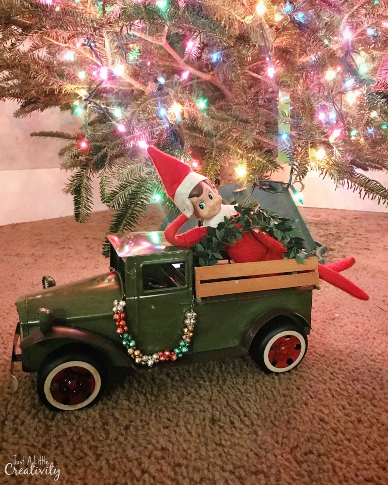 elf on the shelf in a vintage truck
