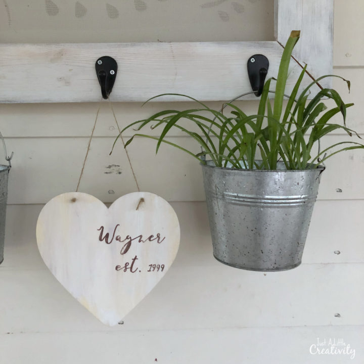 This is a creative and budget friendly way to add farmhouse style to your valentines decor, using a wood heart from Dollar Tree